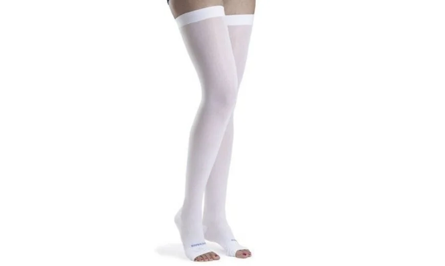 a lady is wearing a white anti embolism stockings