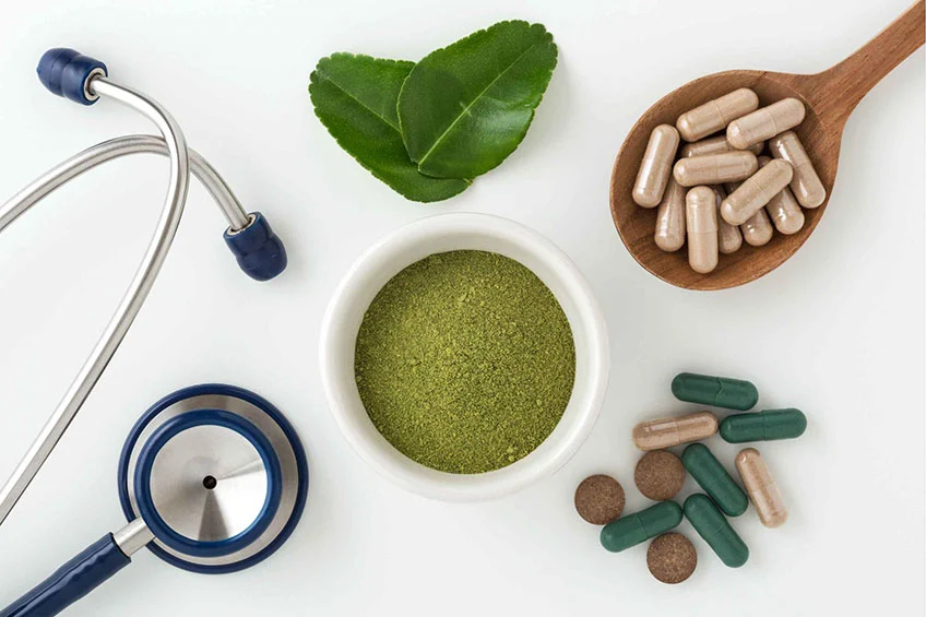 Herbal and modern medicines on the table beside stethoscope